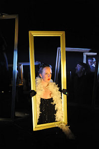 Green-Eye with serious face in mirror