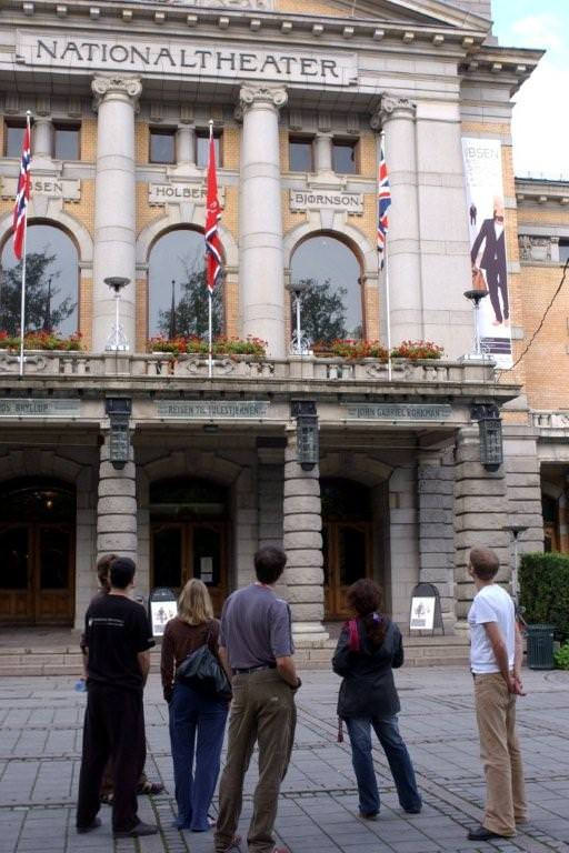 The team of A Doll&#039;s House are looking at the Union Jack on the flag post above the main entrance of at the Norwegian National Theatre (Nationaltheatret).